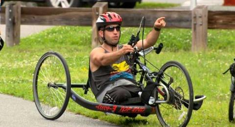 Temo Dadani riding handcycle.