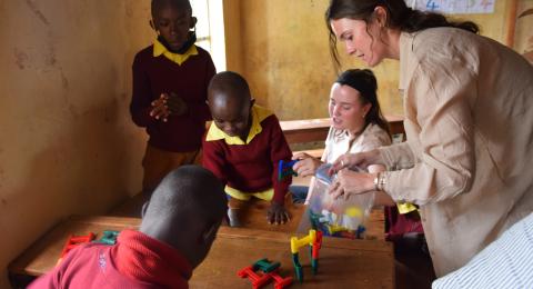 UNH OT students Maggie and Ashley with Wamanyu Special School students