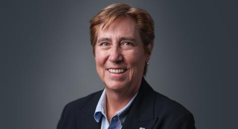 New UNH provost Jeanette Riley poses for a photo in front of a gray background