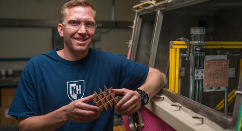 Ben Mitchell stands next to his Water Droplet Machining prototype