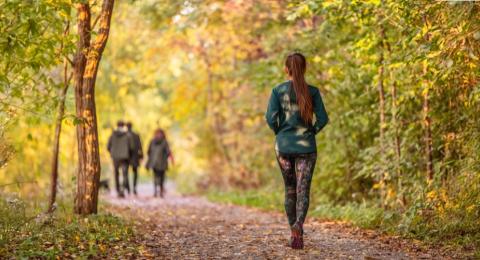 Woman walking on a trail in a park