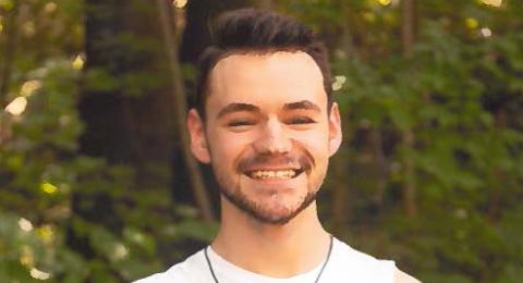 UNH student Wesley Coffin smiling at the camera