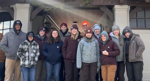 Photo of UNH students at a New England Dairy Farm