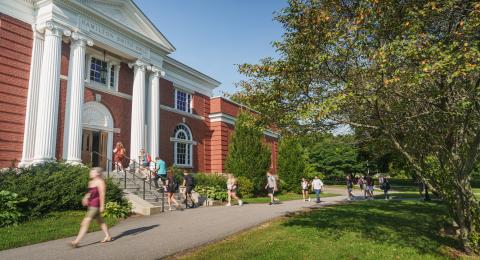 Students walk by the exterior of Hamilton Smith Hall