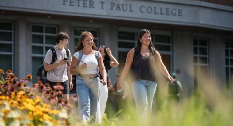UNH students walking by Paul College