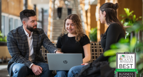 Paul College professor working with students