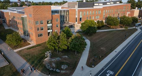 Aerial view of Kingsbury Hall, a brick academic building
