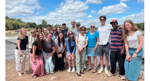 a group of people standing outside together