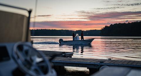 A UNH boat on Great Bay at sunrise