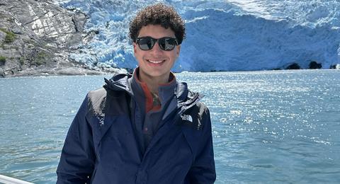 Portrait of Cole Robinson on a boat in the Arctic