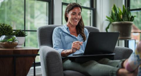 Working professional completes an online course at home.