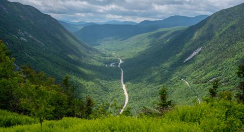 Drone image of White Mountains with a road down the middle