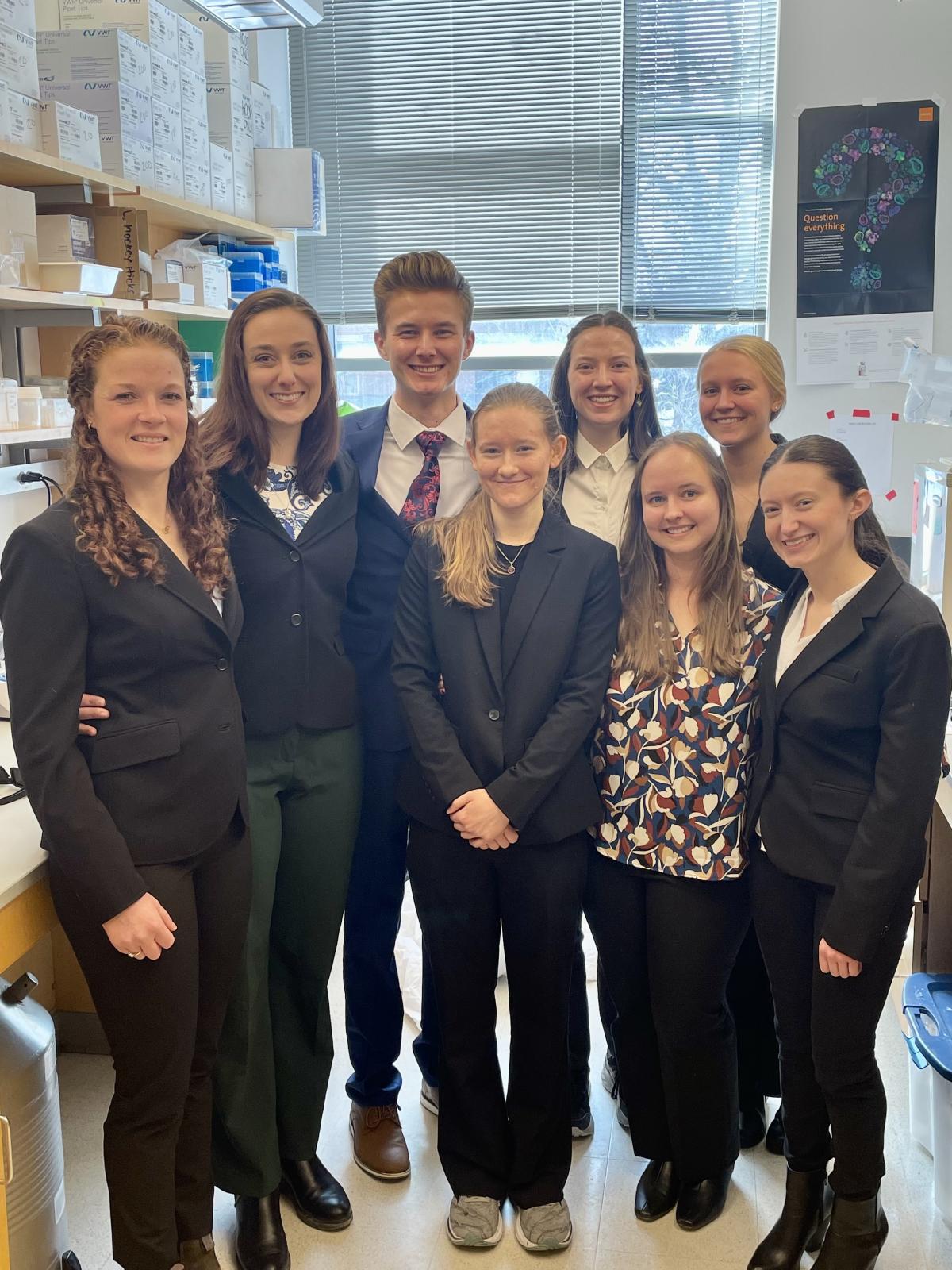 Jaxson with group in lab