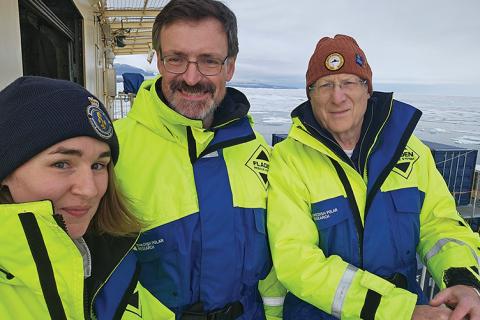 The UNH team — Elizabeth Weidner ’22G, CCOM associate director Brian Calder and CCOM director Larry Mayer — take in the Arctic scenery from the icebreaker Oden