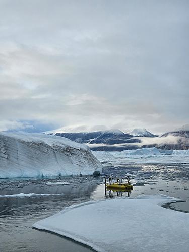 Seafloor Systems Echoboat, a remote- controlled vessel, helps the UNH team map the seafloor of Victoria Fjord in northern Greenland.