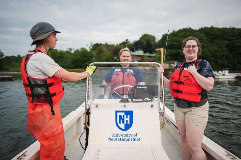 Conducting research on a boat in the Great Bay Estuary