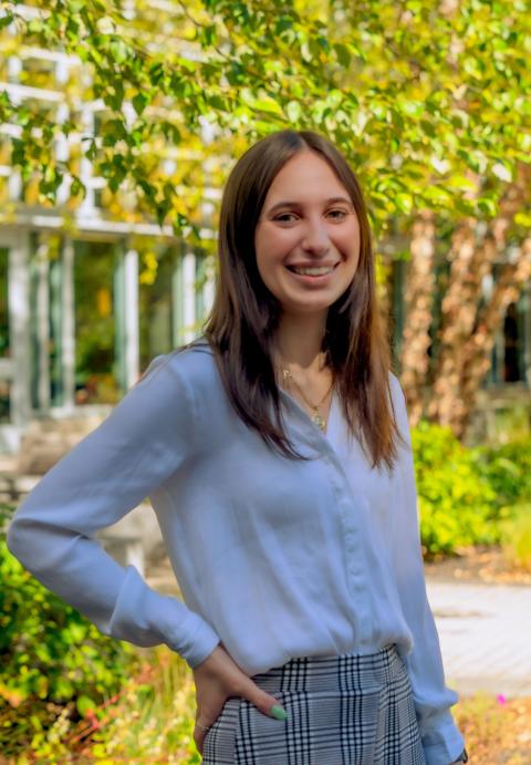 UNH Student Abriana Teodoro&nbsp;smiling while waring a white cardigan