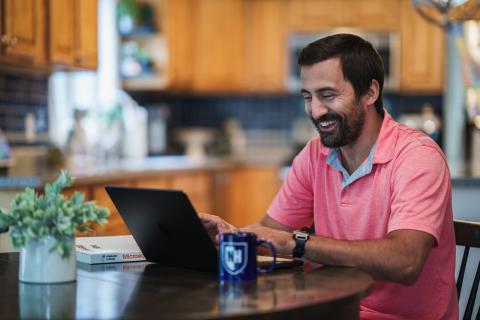 student at home on laptop