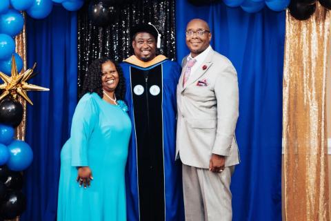 Darius Love with his parents at UNH graduation.
