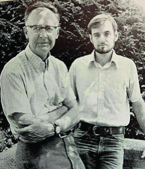 Black and white photo of Glenn Coppelman standing next to Paul Burns