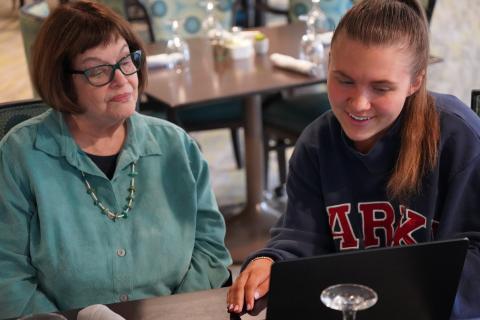 Riverwoods resident Sharyn Zunz interacts with a UNH student.                                             
