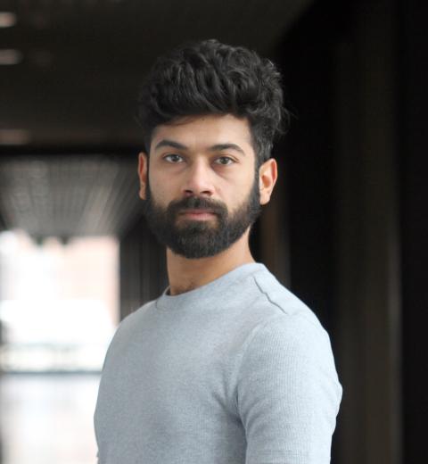 Portrait of dark haired male with beard