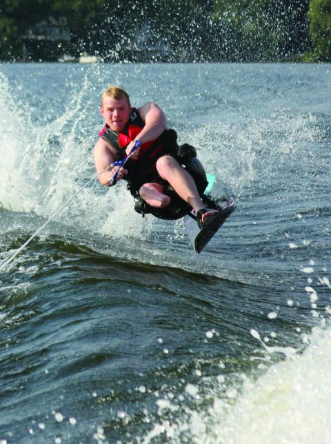 Craig Brady '16, a U.S. Marine who lost his lower right leg while serving in Afghanistan, water skis and plays competitive hockey with Northeast Passage. Photo by Danielle Durocher.