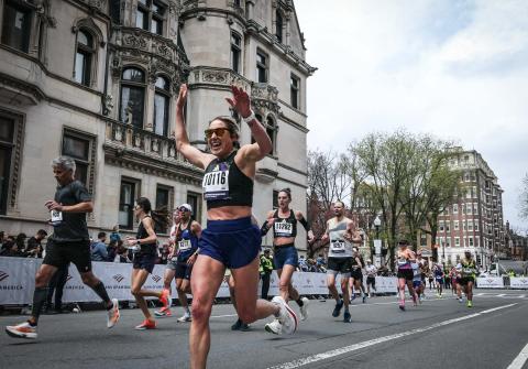 Kristina Robb ’24, ’26G prepares to cross the finish line at the Boston Marathon.