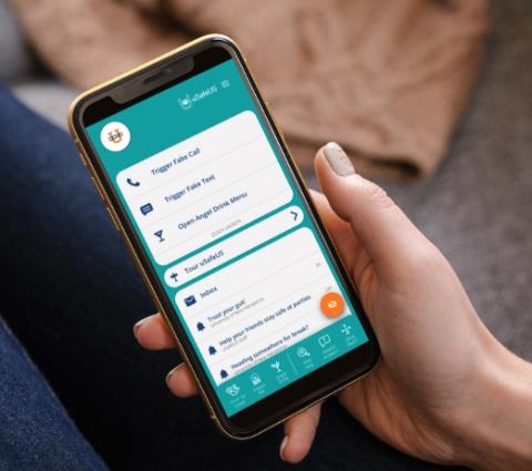 Hand holding smartphone with uSafeUS app open