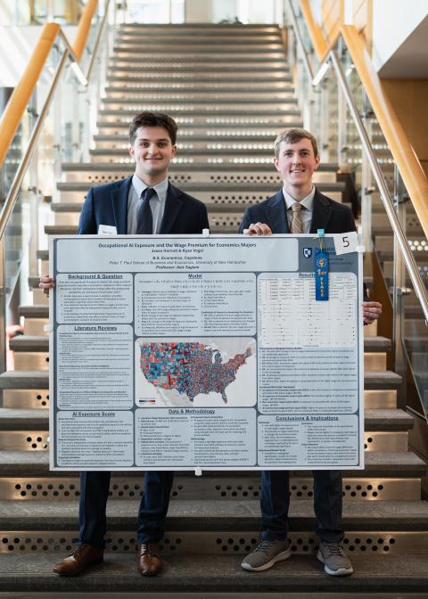 Ryan Vogel and Jesse Harriott ‘27 with their first-place poster.