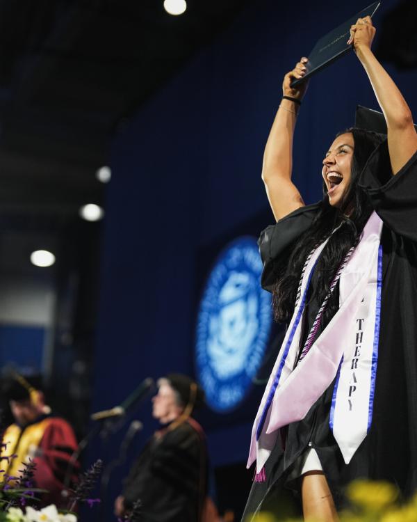 UNH student at commencement ceremony