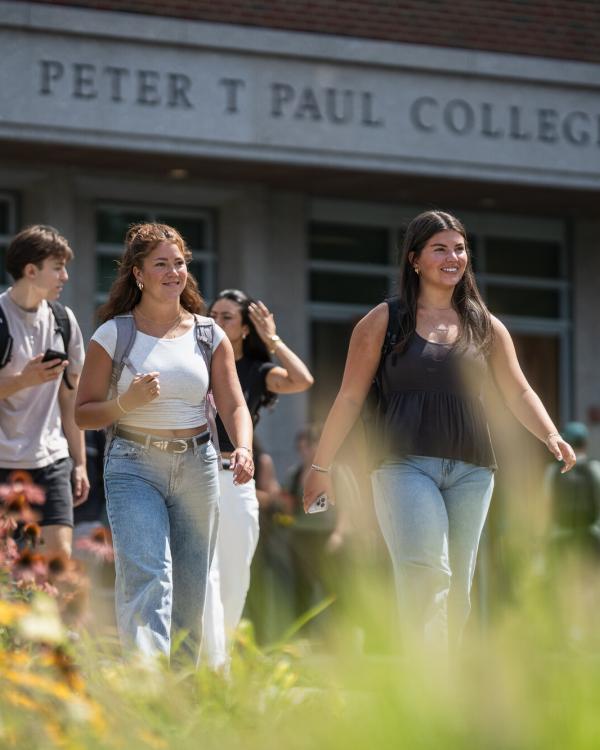 UNH students walking by Paul College
