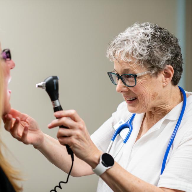 nurse examining patient