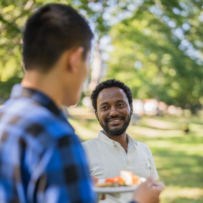 Two international students talking during orientation